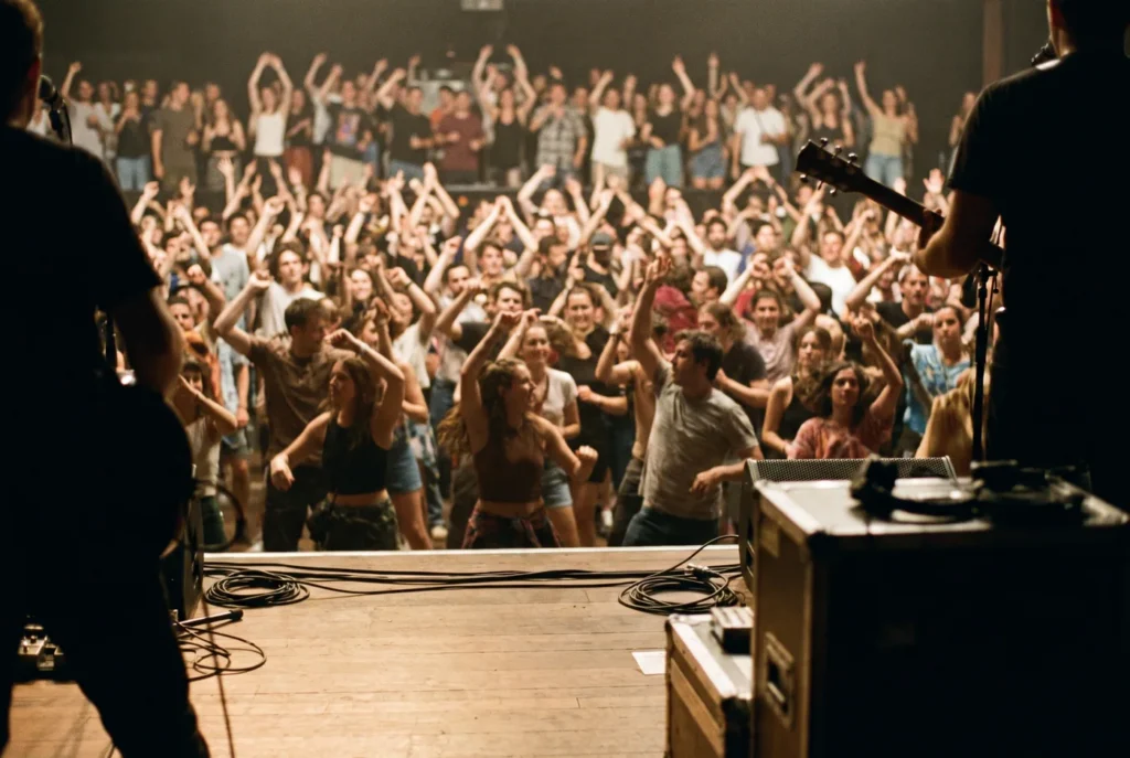 Crowd dancing on the open floor seen from the stage at Depot Square Events