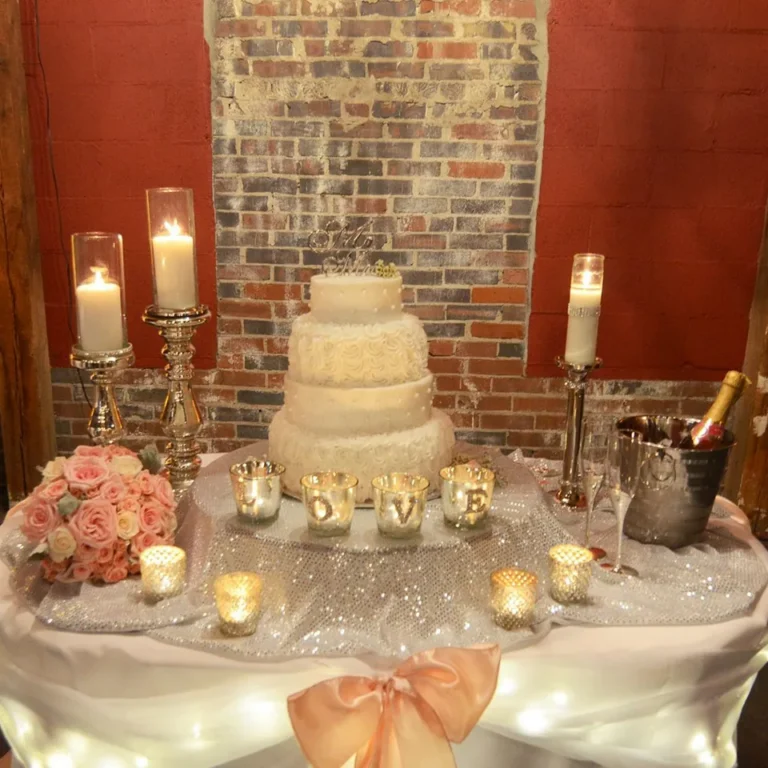 Tiered wedding cake with candlelight at the Gallatin depot