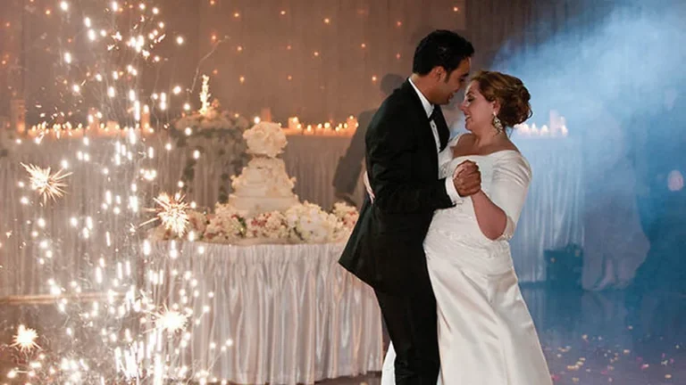Couple's first dance under the string lights at the depot