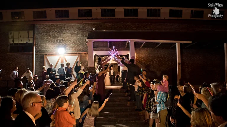 Sparkler send-off outside Depot Square Events at night
